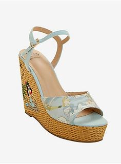 Dress up your beach wear with these classy wedges from Disney! The light blue fabric sandals feature a print from Peter Pan of the mermaids in their lagoon and an embroidered mermaid on the side of the faux straw wedge heel. Rose gold metal buckle clasp at the ankle. Officially licensed by Her Universe Fabric upper; rubber sole 5" heel; 1 1/2" platform Imported Peter Pan Mermaid Lagoon, Classy Wedges, Peter Pan Mermaids, Embroidered Mermaid, Fabric Sandals, Fold Over Boots, California Trip, Light Blue Fabric, Mermaid Lagoon