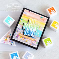 an image of a happy day card with dog paw stamping and rubber stamps on it