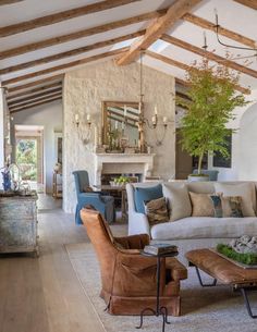 a living room filled with furniture and a fire place