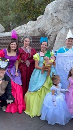 a group of people in costume posing for a photo