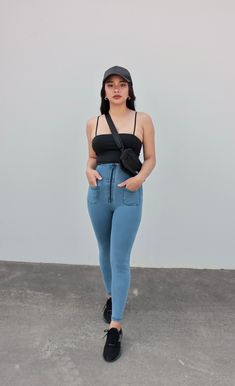 A woman with light blue jeans and a black top outfit. She completes the look with comfy black rubber shoes Fitted Medium Wash Pants With Zip Fly, Fitted Denim Blue Pants With Zipper Closure, Casual Blue Pants With Zipper Closure, High Rise Denim Blue Bottoms With Zipper Closure, High Rise Denim Blue Bottoms With Zipper, High Waist Dark Wash Pants With Zip Fly, High Rise Medium Wash Bottoms With Zipper Closure, High Rise Bottoms With Zipper Closure In Medium Wash, High Rise High Stretch Denim Pants