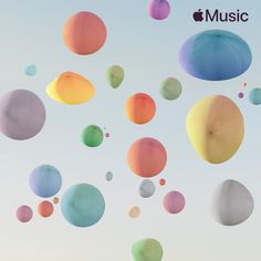 colorful balloons are floating in the air on a clear day with an apple music logo above them