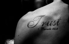 the back of a man's chest with a tattoo saying, feast and prove