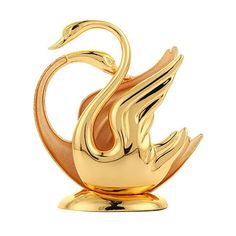 a gold swan sculpture on a white background