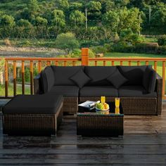 a couch and ottoman on a wooden deck