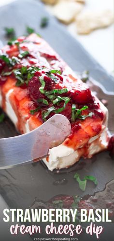 strawberry basil cream cheese dip on a plate with a knife