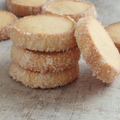 several sugar cookies stacked on top of each other