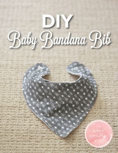 a baby bandana bib is laying on the floor next to a button that says diy baby bandana bibs