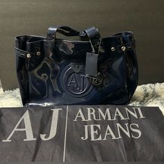 This Is A Very Chic Armani Tote Bag. Wear It Casually Or Not, Gives Your Wardrobe A Boost. Comes With Tag And Dust Bag. Bundle And Save On Shipping Blue Shoulder Bag With Logo Hardware For Travel, Blue Bags With Logo Hardware, Luxury Blue Shoulder Bag With Logo Hardware, Designer Bags With Logo Hardware For Shopping, Designer Blue Bags With Logo Hardware, Designer Shopping Bags With Logo Hardware, Elegant Blue Bag With Logo, Elegant Blue Bags With Logo, Casual Double Handle Bag With Logo