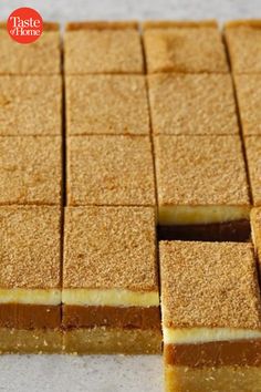 several squares of brown and white cake on a table