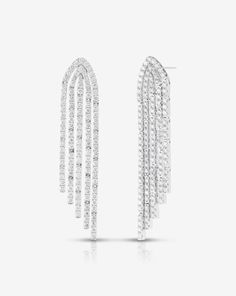 Why We Love Them: Strings of sparkling diamonds delicately hang at graduating lengths in these striking statement earrings. Evening Diamond Cut Chandelier Earrings, Diamond Cut Chandelier Earrings For Evening, Evening Chandelier Drop Earrings With Diamond Accents, Luxury Long Drop Cubic Zirconia Linear Earrings, Luxury Linear Earrings With Prong Setting For Evening, Party Long Drop Linear Earrings Fine Jewelry, Luxury Long Drop Diamond Earrings With Diamond Accents, Luxury Long Drop Diamond Earrings With Accents, Evening Linear Earrings With Diamond Accents And Cubic Zirconia