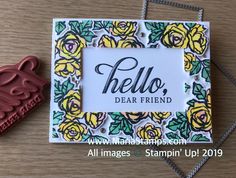 a stamper next to a card that says hello dear friend