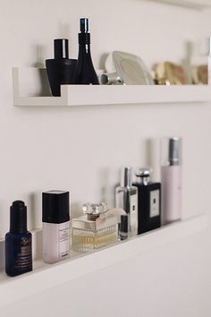 the shelf is filled with different types of cosmetics and personal care products on it's sides