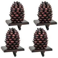 three small pine cones are sitting on shelves