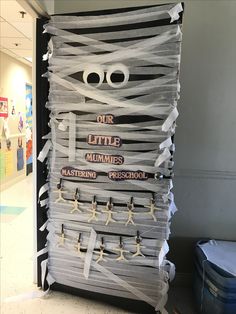 a large stack of paper with cut out eyes and words on it