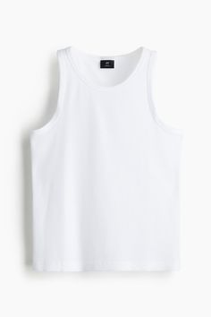 Slim-fit tank top in medium weight  ribbed cotton-blend jersey with a fitted silhouette. Straight-cut hem. Classic Ribbed Tank Top For Spring, Casual Ribbed Cotton Tank Top, Casual Cotton Ribbed Tank Top, Casual Ribbed Tank Top For Spring, Classic Sleeveless Ribbed Top, Casual Ribbed Vest With Tank Straps, Casual Crew Neck Tank Top With Ribbing, Casual Crew Neck Ribbed Tank Top, White Sleeveless Ribbed Top