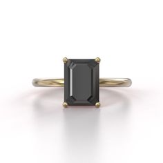 a black diamond ring on a white background