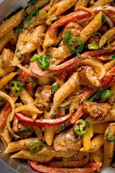 pasta with meat and peppers in a pan