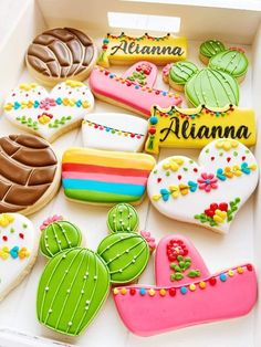 some decorated cookies in a box on a table