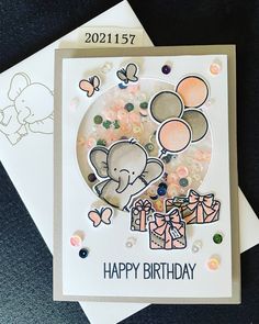 a birthday card with an elephant holding balloons