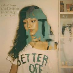 a woman with long hair wearing a t - shirt that says better off dead horse