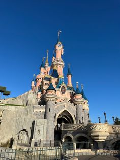 the entrance to sleeping beauty castle at disneyland world