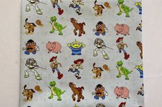 the fabric has many cartoon characters on it