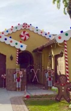 a gingerbread house decorated for christmas with candy canes