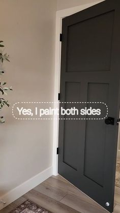 the door is painted black and has white lettering on it that says yes, i paint both sides