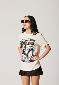 a woman wearing sunglasses and a t - shirt