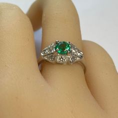 This is part of Chairish’s Fine Jewelry assortment.  Introducing the Emerald Diamond 0.90 Carat Platinum Filigree Milgrain Trim Engagement Ring, finger size 6.5 – a timeless symbol of your love and commitment. This exquisite piece combines classic elegance with intricate details, making it the perfect choice for your special moment. 1. Stunning Round Emerald, weighing 0.60 Carat and Diamonds weighing 0.30 Carat: At the heart of this engagement ring lies a breathtaking round emerald and diamonds. Heirloom Emerald Diamond Ring For Formal Events, Luxury Solitaire Emerald Ring For Formal Occasions, Timeless Emerald Anniversary Ring, Timeless Emerald Wedding Anniversary Ring, Timeless Diamond Emerald Ring For Anniversary, Heirloom Solitaire Emerald Diamond Ring, Formal Emerald Rings Fine Jewelry, Classic Princess Cut Emerald Jewelry, Heirloom Emerald Ring With Gia Certification