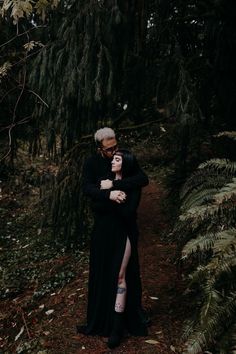 an older couple embracing in the woods