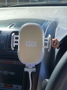 an image of a car radio holder attached to the dashboard