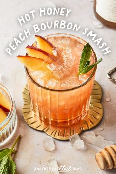 a peach bourbon smash cocktail with mint garnish