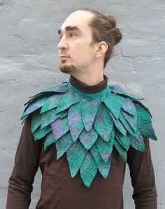 Transform your look with our Leaves Collar Cape  An exquisite accessory designed for fantasy enthusiasts and nature lovers. This elven wardrobe piece, crafted from felted wool and adorned with leaves. The leaf features shades of green and purple, accented with orange veins, creating a magical and mysterious appearance. The lower part is adorned with transitions from green to burgundy and purple, giving the accessory a unique and stylish look, evokes a sense of magic and mystery. Perfect for role Handmade Fantasy Costume Accessories, Handmade Fantasy Costume Accessories For Events, Handmade Fantasy Costume Accessories For Fantasy Events, Green Fantasy Costume Accessories For Party, Druid Cosplay, Leaf Shawl, Fairy Clothing, Cosplay Fairy, Magical Necklace