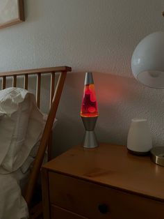 a lamp that is on top of a night stand