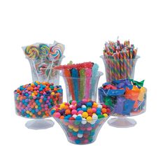 an assortment of candy and candies in glass vases