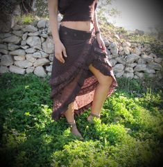 ♡ Designed in a unique free flowing 3 layered fashion that wraps around, this skirt is perfect for every occasion. It is made with 100% cotton and a beautiful lace pattern to keep you comfortable in every situation whether it is a festival or doing daily activities. Wear this skirt to feel magical and beautiful! Please pick your preferred color option from the drop-down menu above. ✦ Sizing Wrap around style - One size fits most From S - XL ✦ Colors - Brown - Massala - Beige - Green - Bordeaux - Bohemian Asymmetrical Maxi Skirt With Fitted Style, Bohemian Asymmetrical Fitted Maxi Skirt, Bohemian Fitted Asymmetrical Maxi Skirt, Fitted Bohemian Asymmetrical Skirt, Ruffled Skirt Bottoms For Festival, Flowy Mini Wrap Skirt For Festival, Festival Ruffled Skirt Bottoms, Bohemian Tiered Wrap Skirt, Bohemian Asymmetrical Mini Skirt