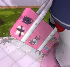 a pink suitcase with stickers on it sitting in front of a wall and floor