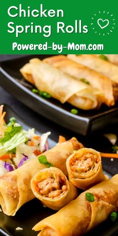 chicken spring rolls on a black plate with coleslaw and salad in the background