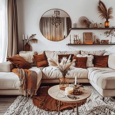 a living room filled with lots of furniture and decor on top of a white rug