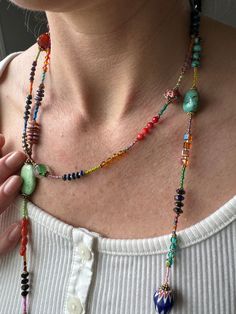 Dive into the world of vibrant gemstones with our Extra Long Boho Color Block Necklace, an exquisite 54-inch masterpiece that pays homage to the rich tapestry of nature's hues. This necklace is not just an accessory; it's a captivating journey through a spectrum of colors, handcrafted by none other than George, a true artisan with a lifelong dedication to the craft. What makes this Turquoise Necklace truly exceptional is its versatility. At 54 inches in length, it can be artfully double-wrapped Boho Beads Necklace, Rainbow Bead Necklace, Long Seed Bead Necklace, Boho Necklace Layering, Beaded Jewelry Inspiration, Boho Beaded Necklace, Colorful Beaded Necklace, Boho Style Necklaces, Valley Village