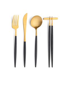 gold and black utensils are lined up on a white surface with one fork, the other knife and two spoons