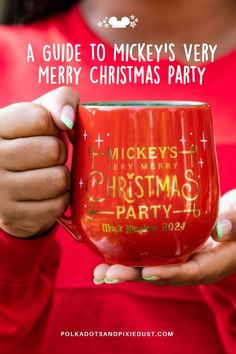 a woman holding a red mug with the words, a guide to mickey's very merry christmas party