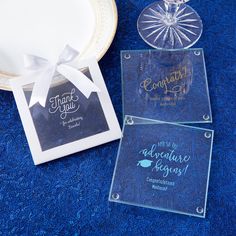 three clear acrylic coasters sitting on top of a blue carpet