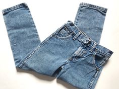 These awesome 90's wranglers are tagged a vintage 7 and best fit a modern 6. I've provided measurements in the photos for an accurate fit. They're USA made with a great high rise and slim fit. The perfect unisex cut that looks great with everything from tiny arq camis to chunky doen knits ✨(9) Fitted Full Length Rigid Denim Jeans, Fitted Full-length Denim Jeans, Fitted Medium Wash Rigid Denim Pants, Trendy Fitted Jeans In Rigid Denim, Trendy Fitted Rigid Denim Jeans, 90s Style Dark Wash Spring Pants, 90s Style Dark Wash Jeans For Spring, Fitted Tapered Leg Summer Jeans, Fitted Rigid Denim Summer Jeans