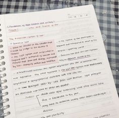 an open notebook with writing on it