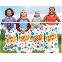 three children standing in front of two towels with the words party hop on them