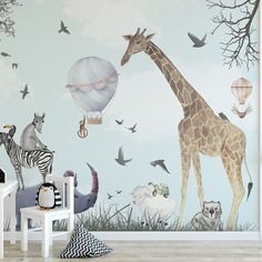 a wall mural with animals and hot air balloons