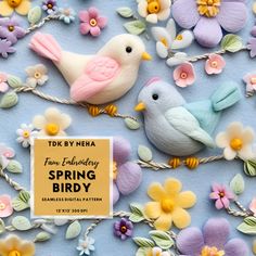 two small birds sitting on top of flowers next to a sign that says spring birdy